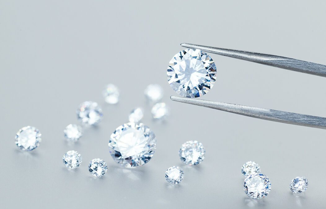 Precious stones for jewellery on light background for marin gold drop