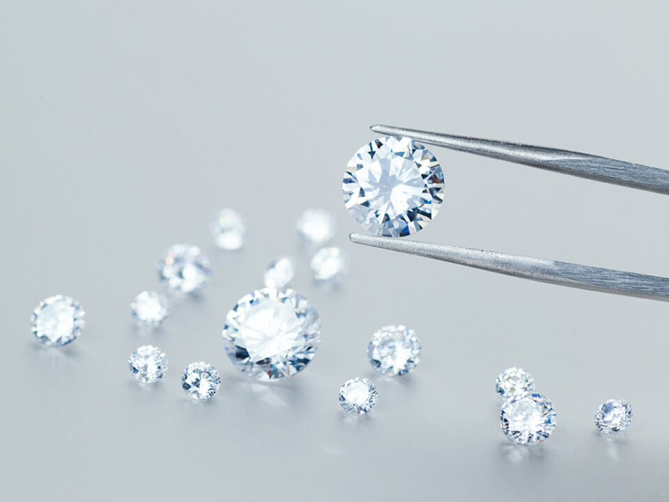Precious stones for jewellery on light background for marin gold drop
